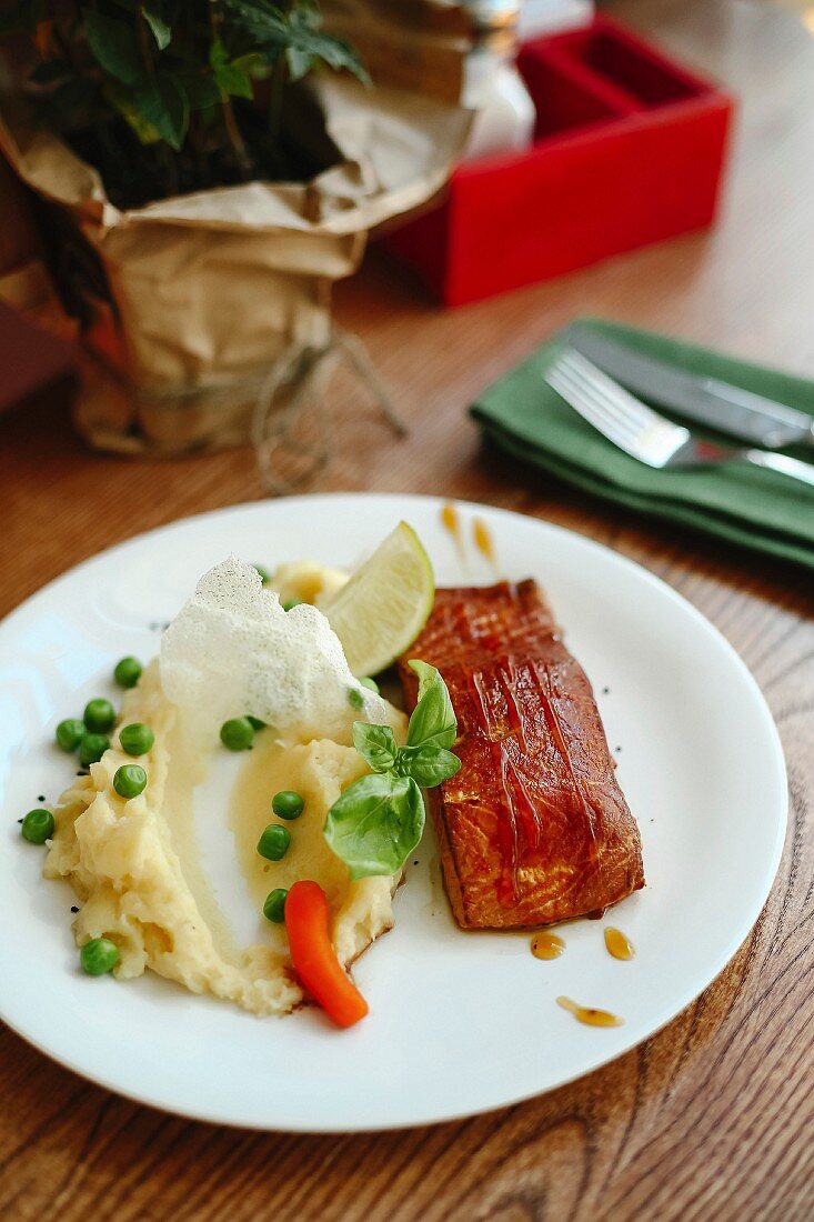 Teriyaki salmon with mashed potato and peas