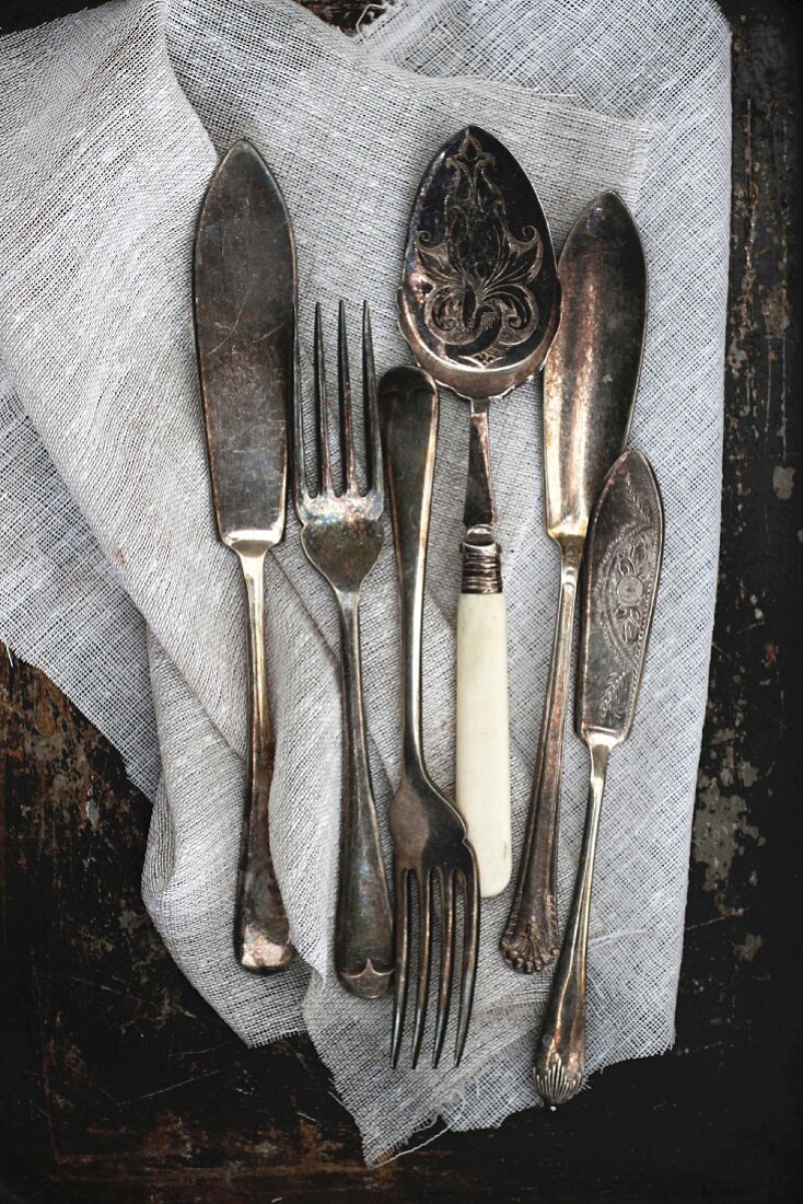 Antique cutlery on a linen cloth