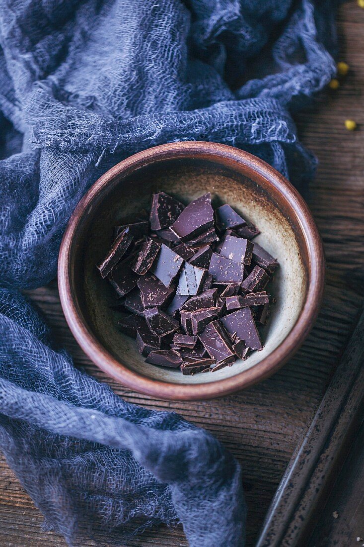 Dark chocolate chunks in a small bowl