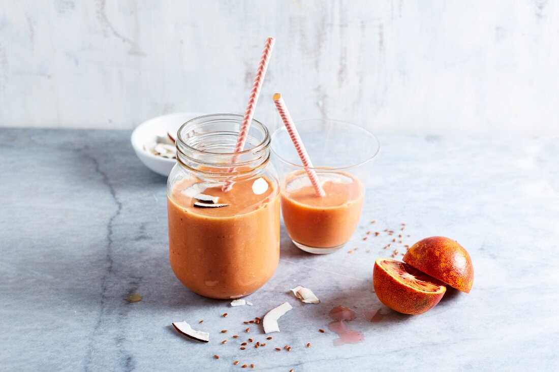 Blood orange smoothie with apple, coconut cream and linseed