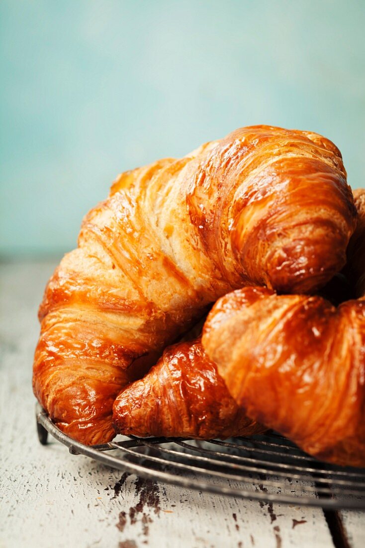 Freshly baked croissants on rustic background