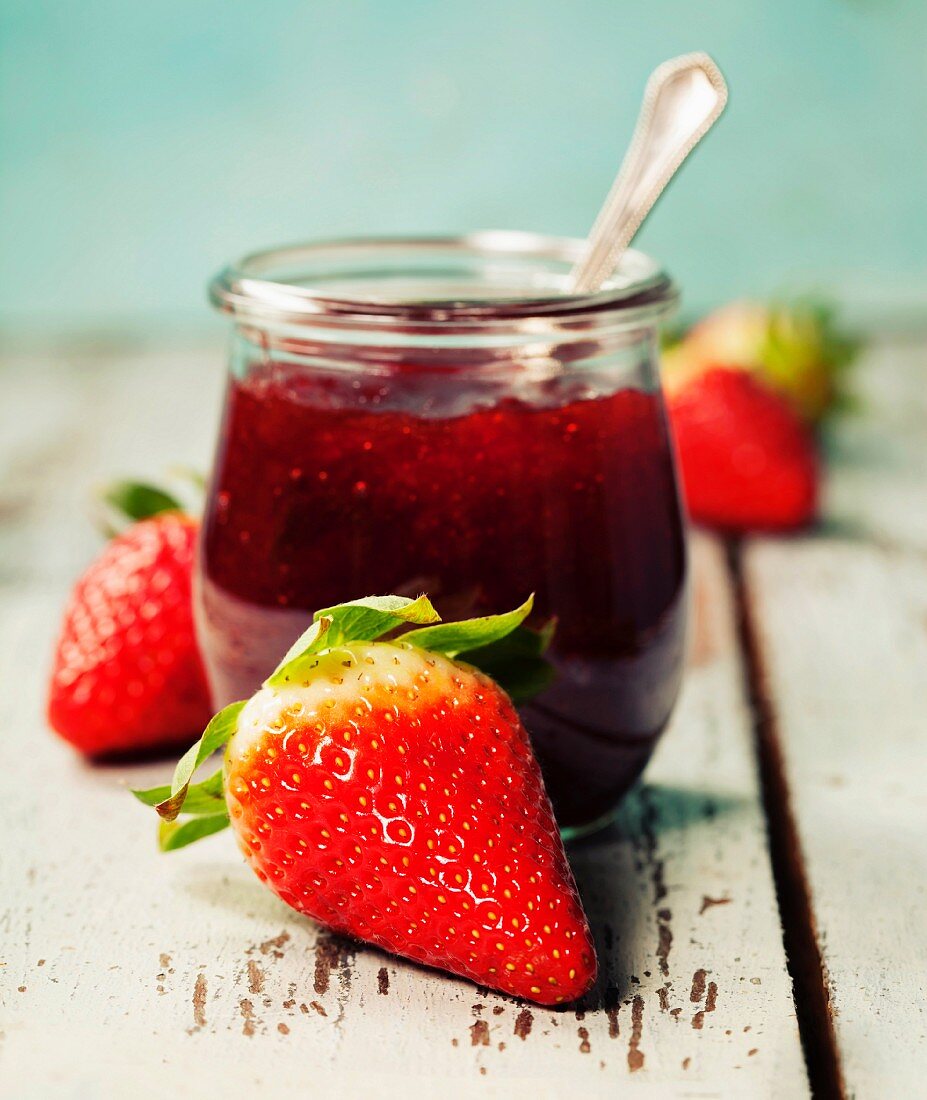 Homemade strawberry jam and fresh strawberries
