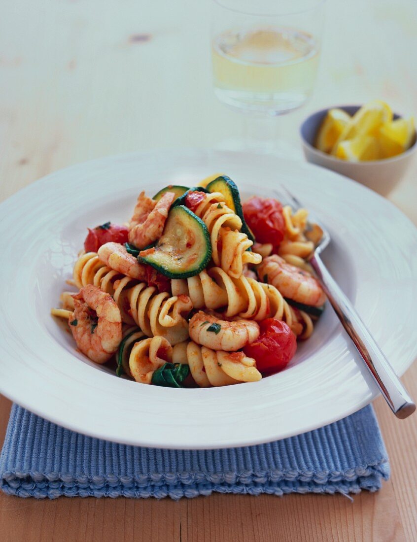 Pasta with shrimps, tomatoes and zucchini