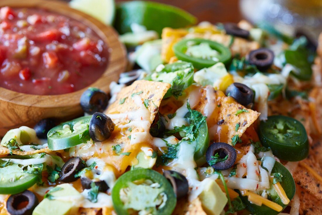 Nachos with cheese, jalapenos, black olives and salsa (Mexico)