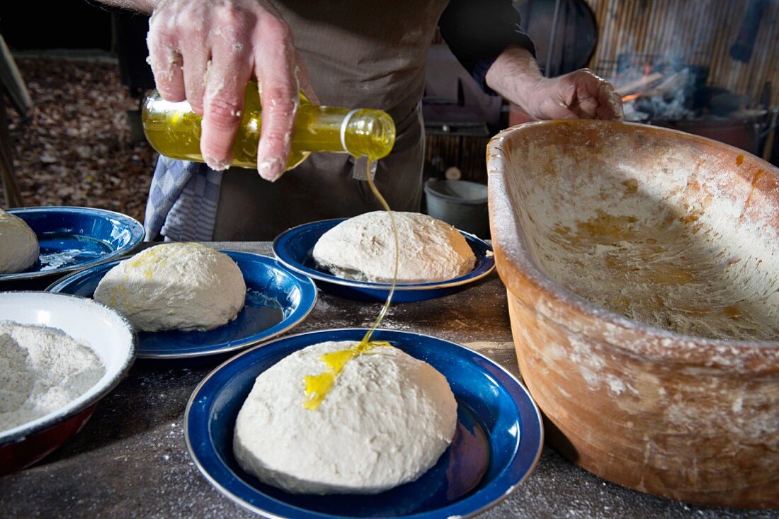 Homemade bread dough drizzled with oil (camping)