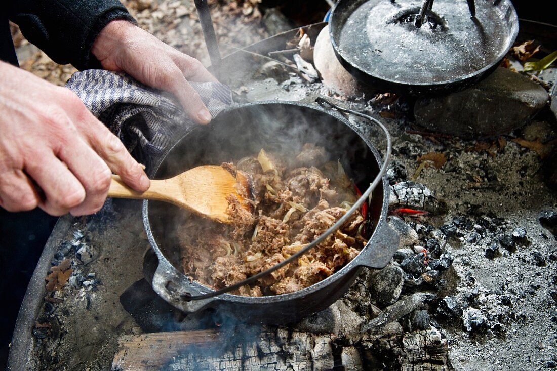How to make a meat dish in a Dutch oven over a fire place