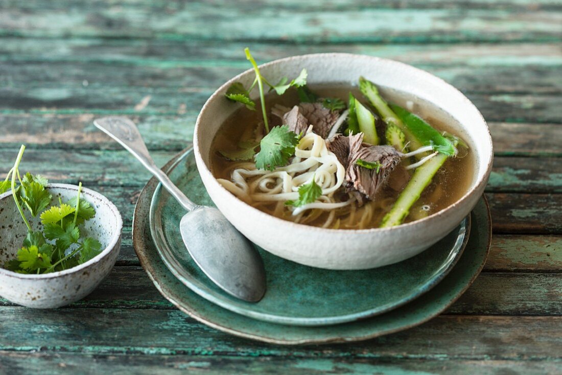 Asian noodle soup with asparagus and prime boiled beef