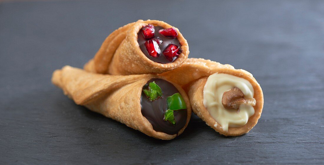 Filled tortilla cones with chilli chocolate, white chocolate with walnut and dark chocolate with pomegranate seeds (Mexico)