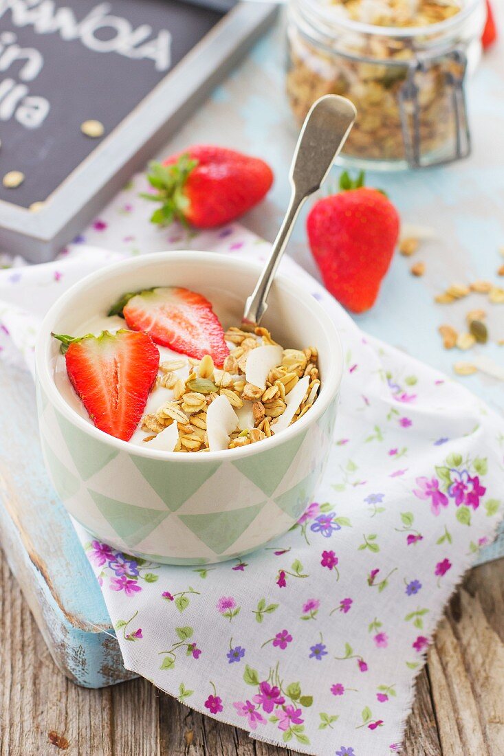 Yogurt with granola and strawberries