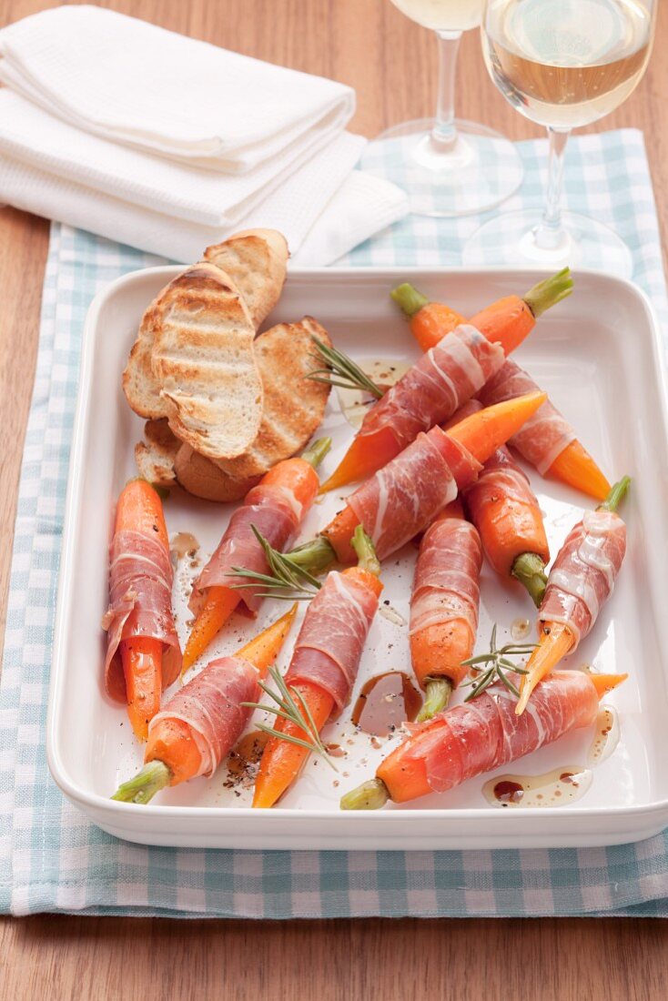 Carrots wrapped in parma ham