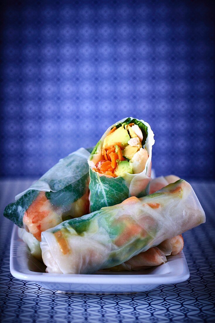 Rice paper rolls stuffed with prawns, avocado, carrots and mint
