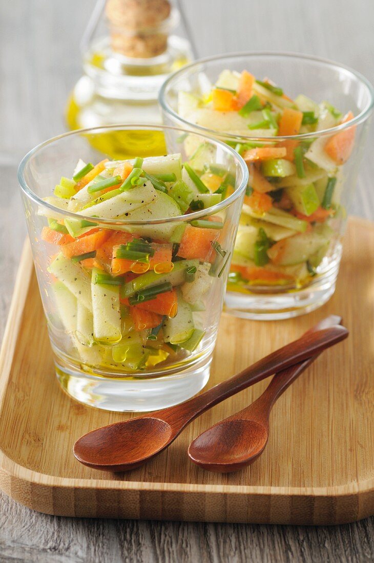 Carrot and apple salad in glasses with a curry and honey vinaigrette