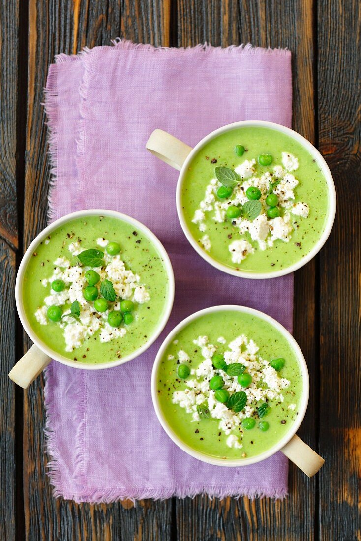Pea cream soup with cottage cheese and mint (top view)