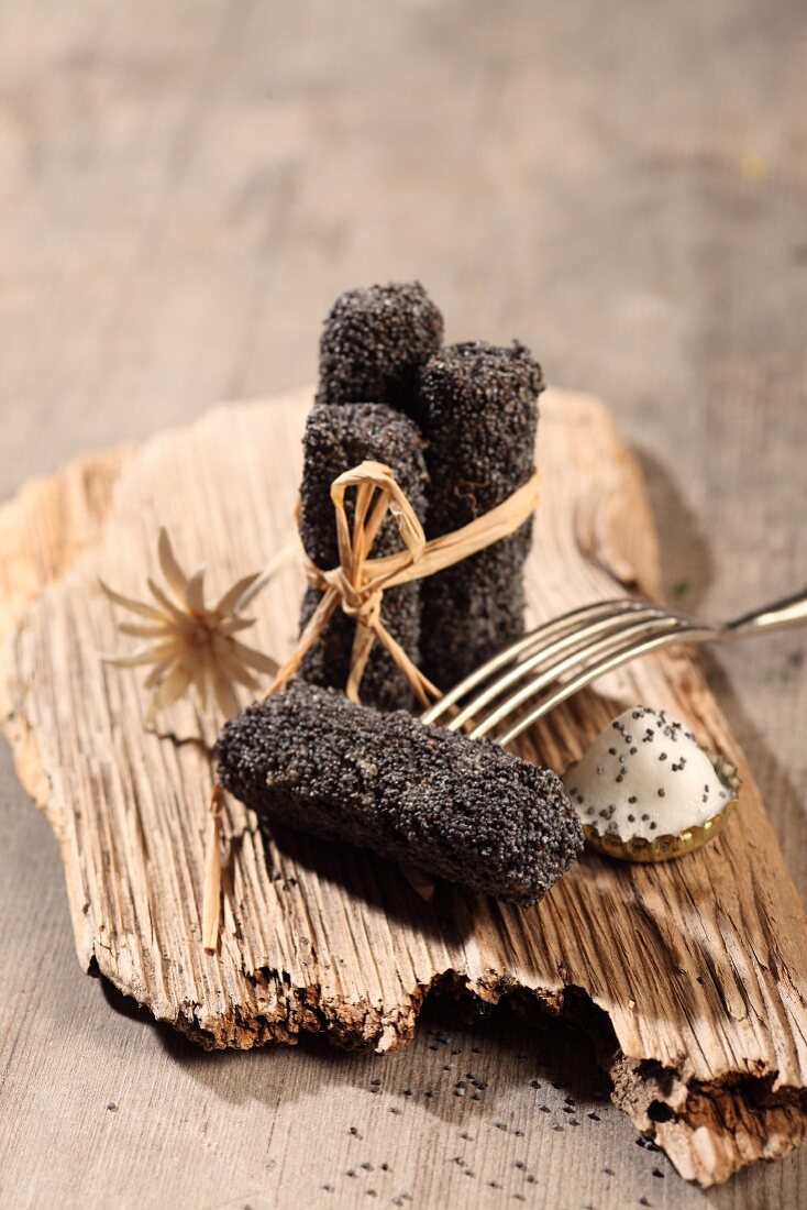 Fried black roots coated in poppy seeds (Bavaria, Germany)