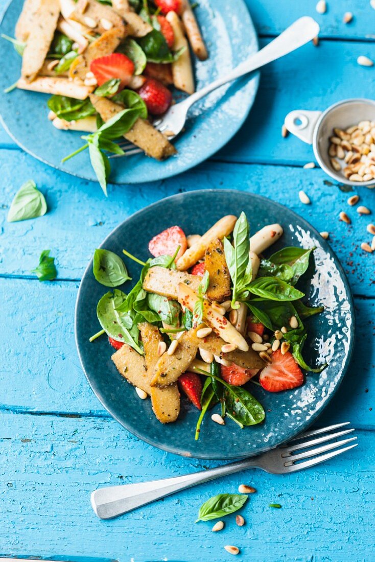 Vegan asparagus and strawberry salad with lupin fillets
