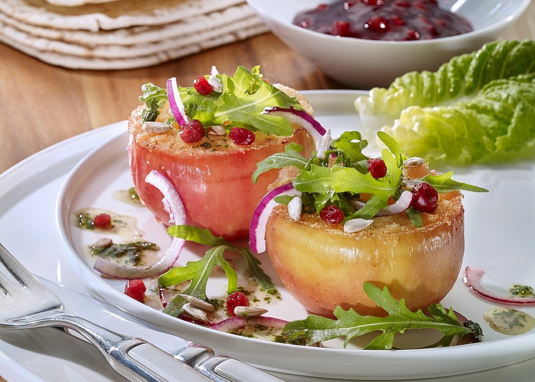 Fried apples with onions, cranberries and arugula