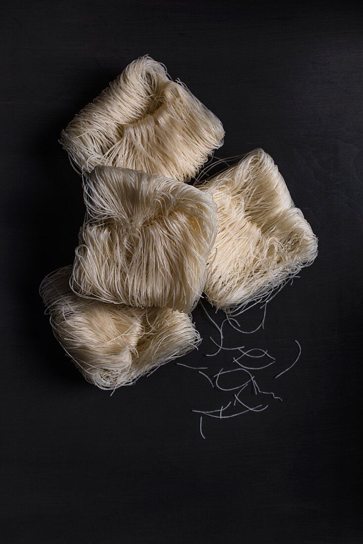 Packet glass noodles against a black background (top view)