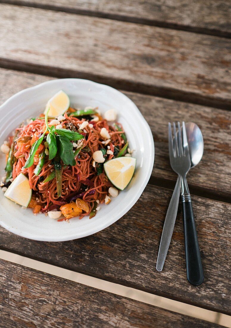 Fried rice noodles with orange, vegetable and cashew nuts