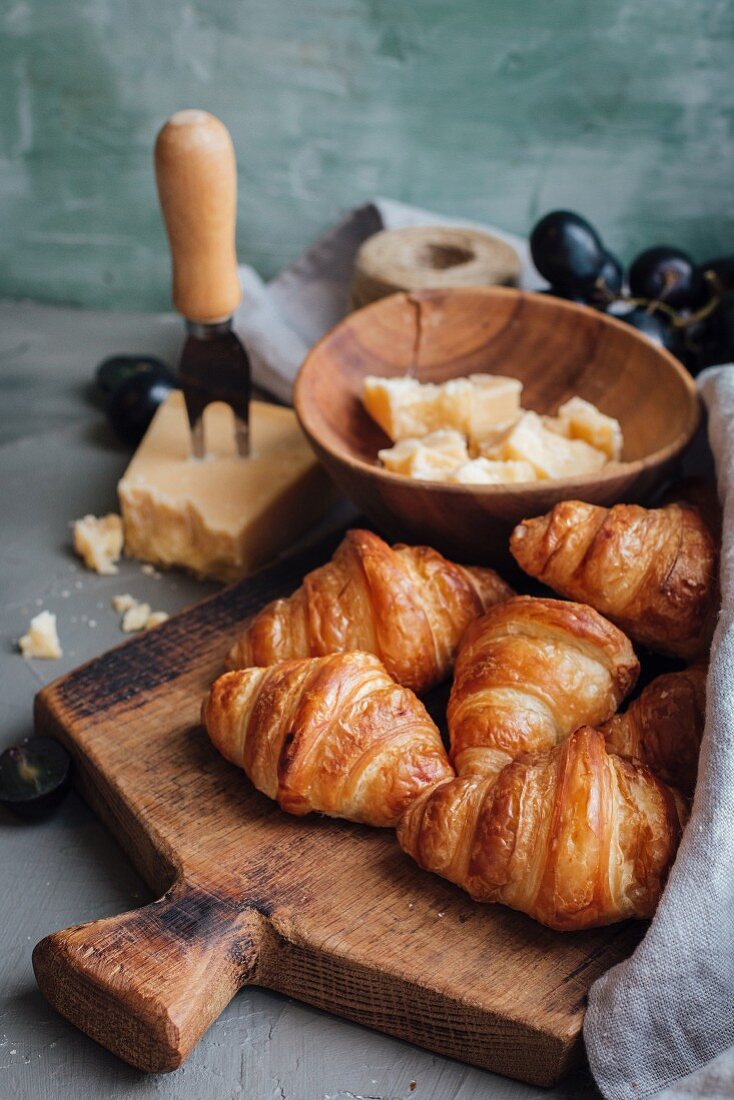 Croissants with hard cheese and grapes