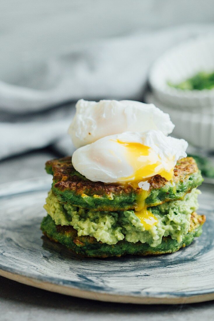 Pea pancakes with avocado puree and poached eggs