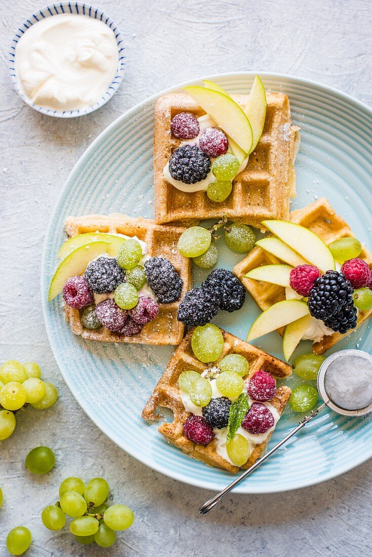 Waffles with fruit and powdered sugar