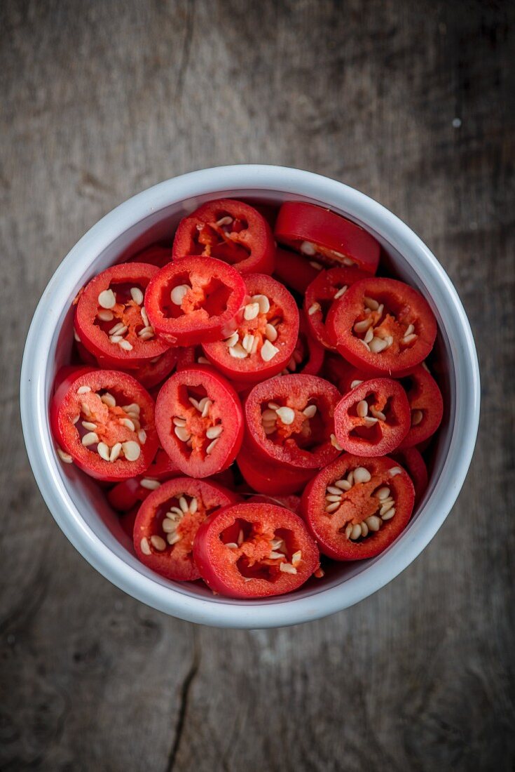 Red chilli rings in a bowl (seen from above)