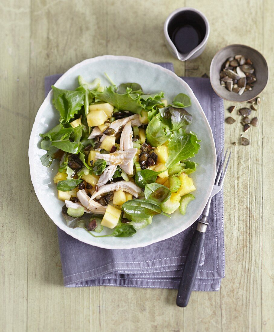 Celery and pineapple salad with poached chicken breast