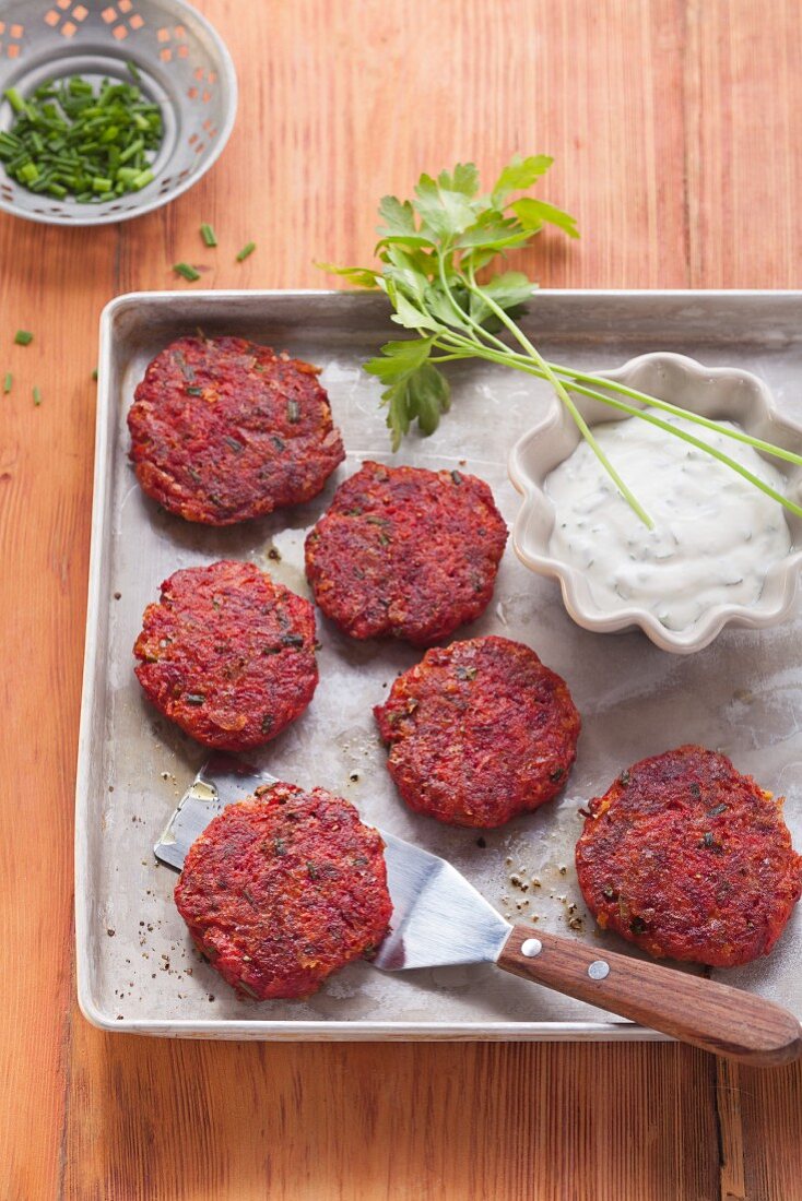 Vegetarian beetroot fritters with herb dip