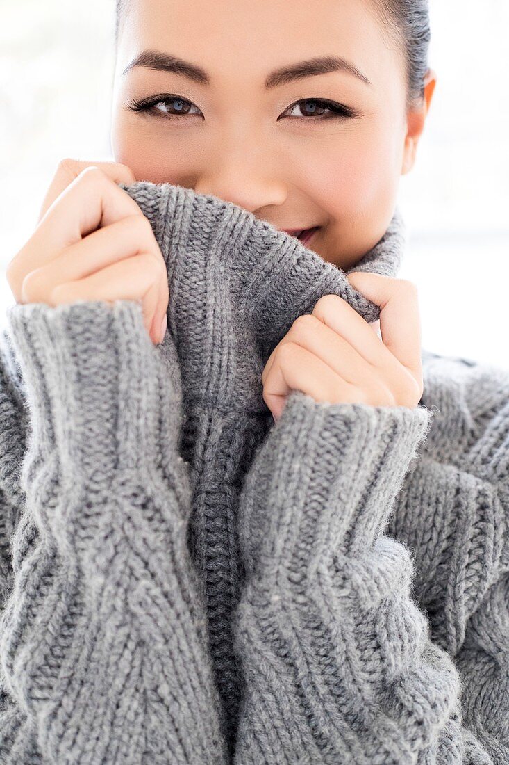 Woman wearing grey knitted sweater