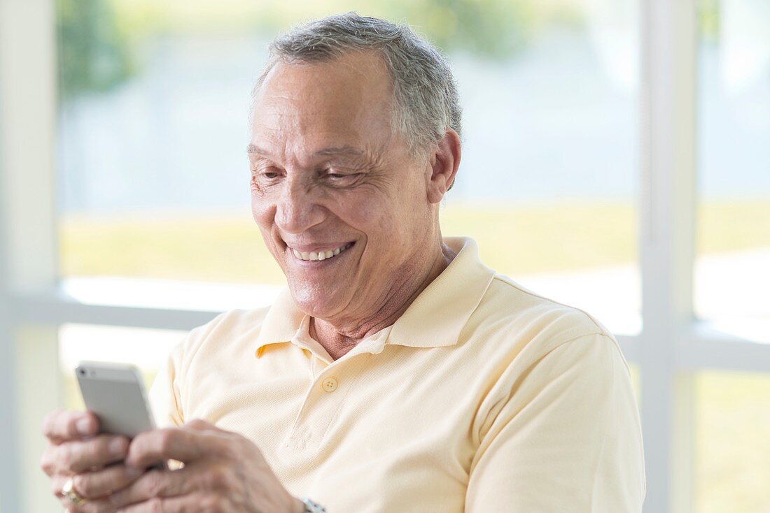 Senior man using cell phone