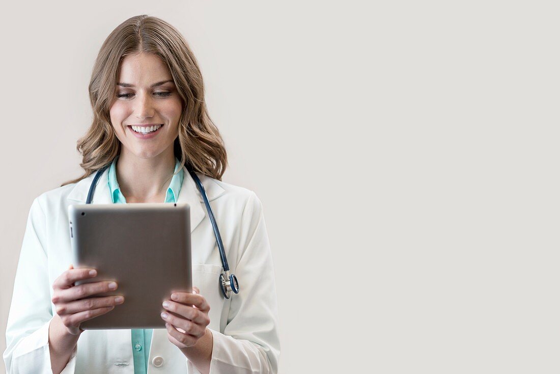 Female doctor holding digital tablet