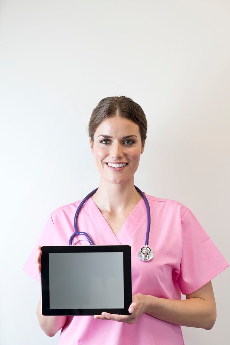 Female nurse holding digital tablet