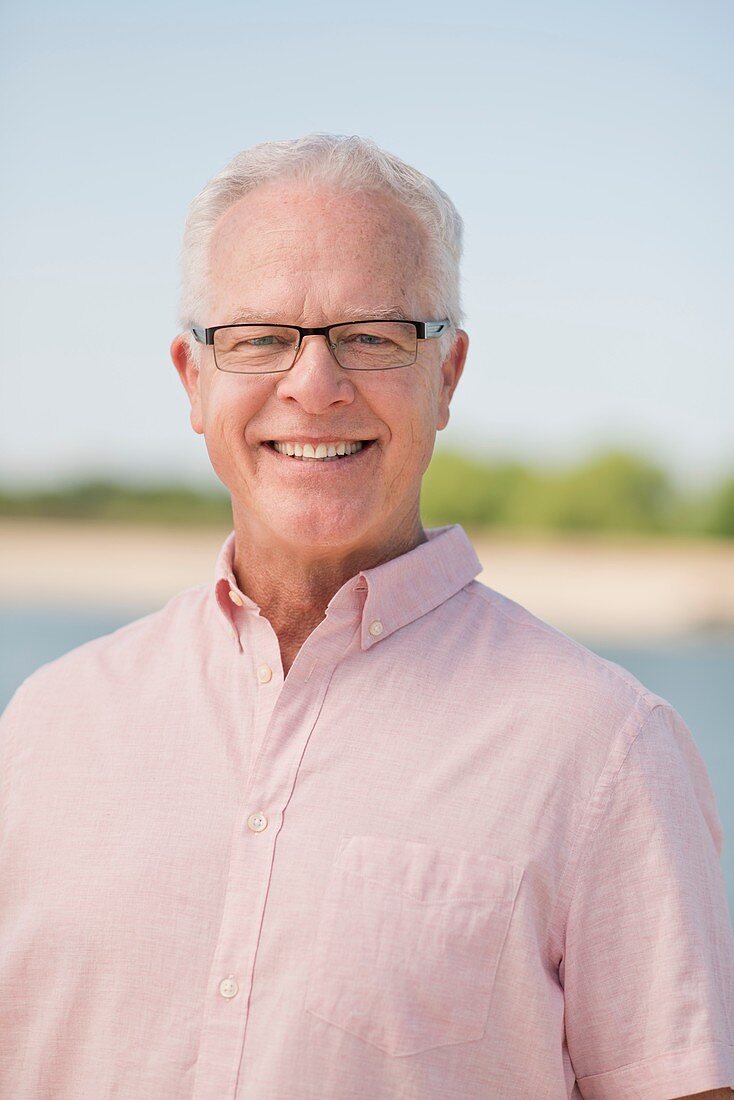 Senior man wearing glasses outdoors