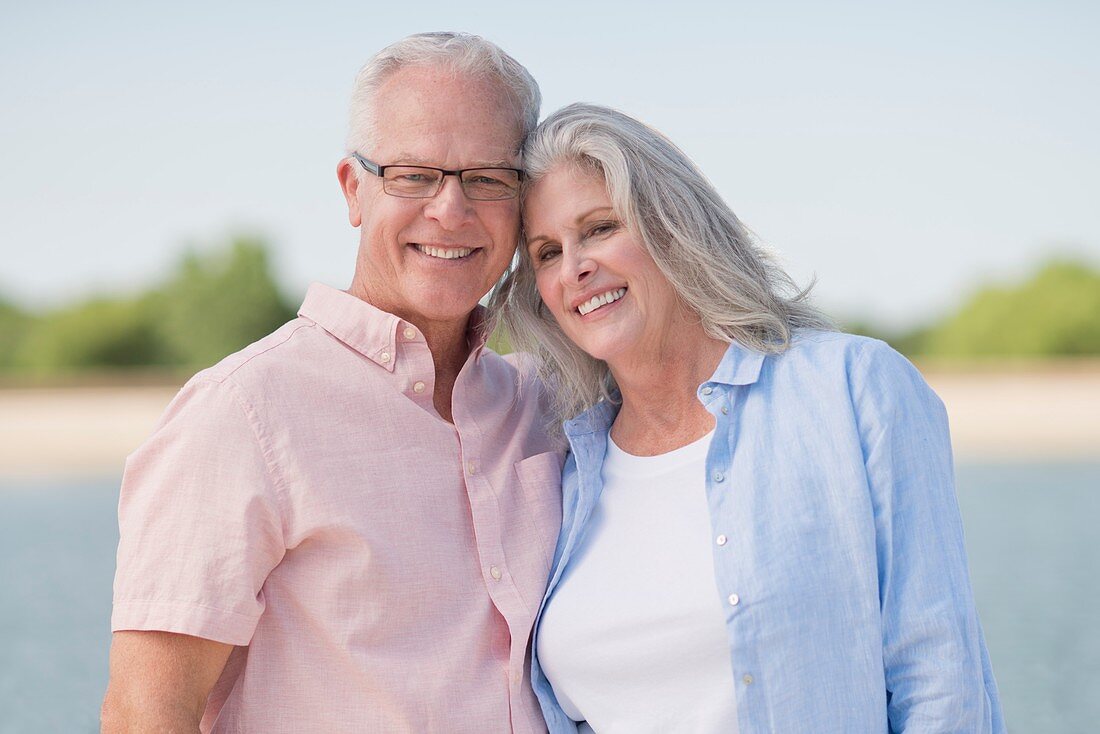 Senior couple smiling outdoors