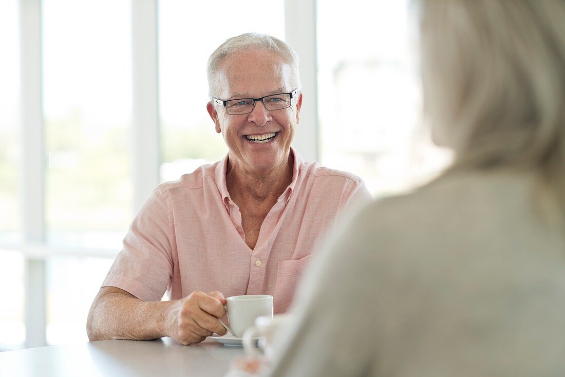 Senior man with cup of tea