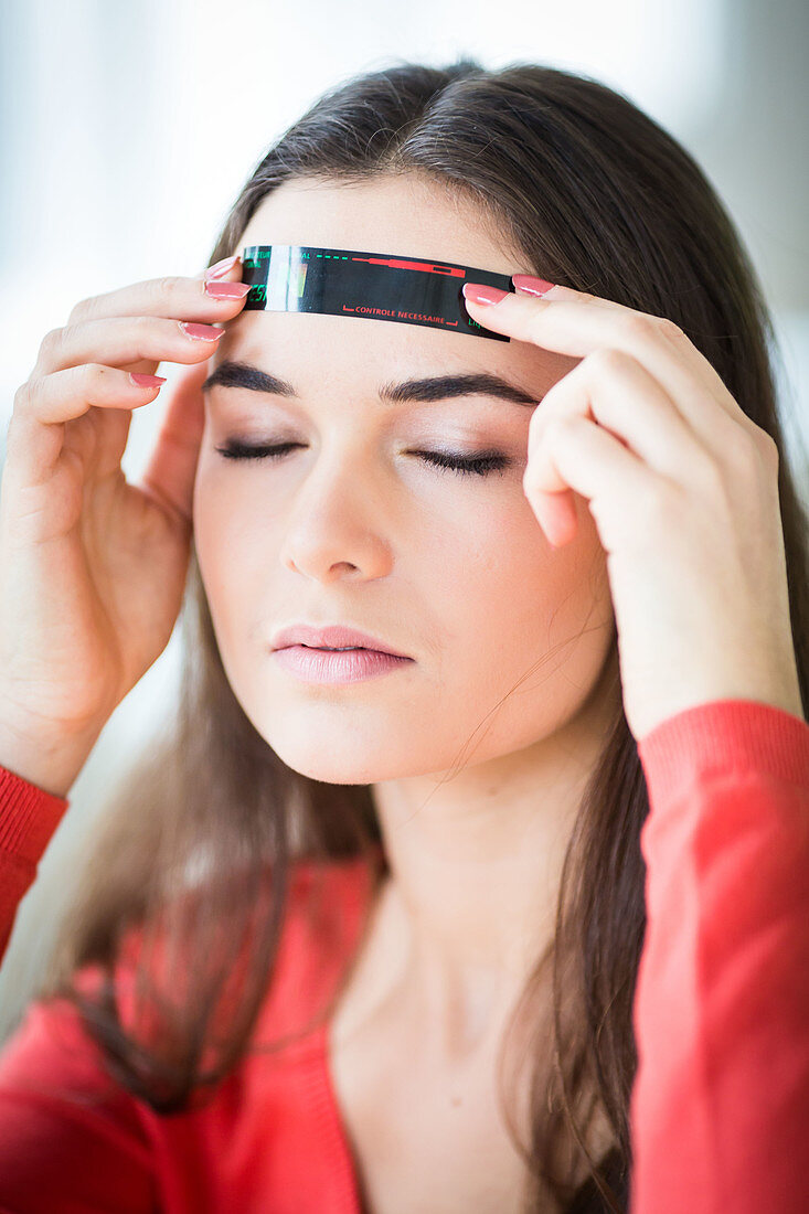 Woman checking her temperature