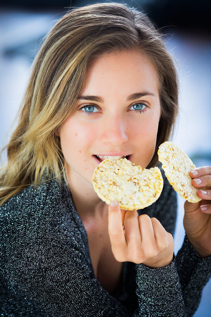 Woman eating a popcorn galette