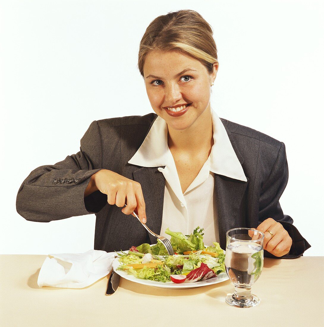 A Woman Eating Salad