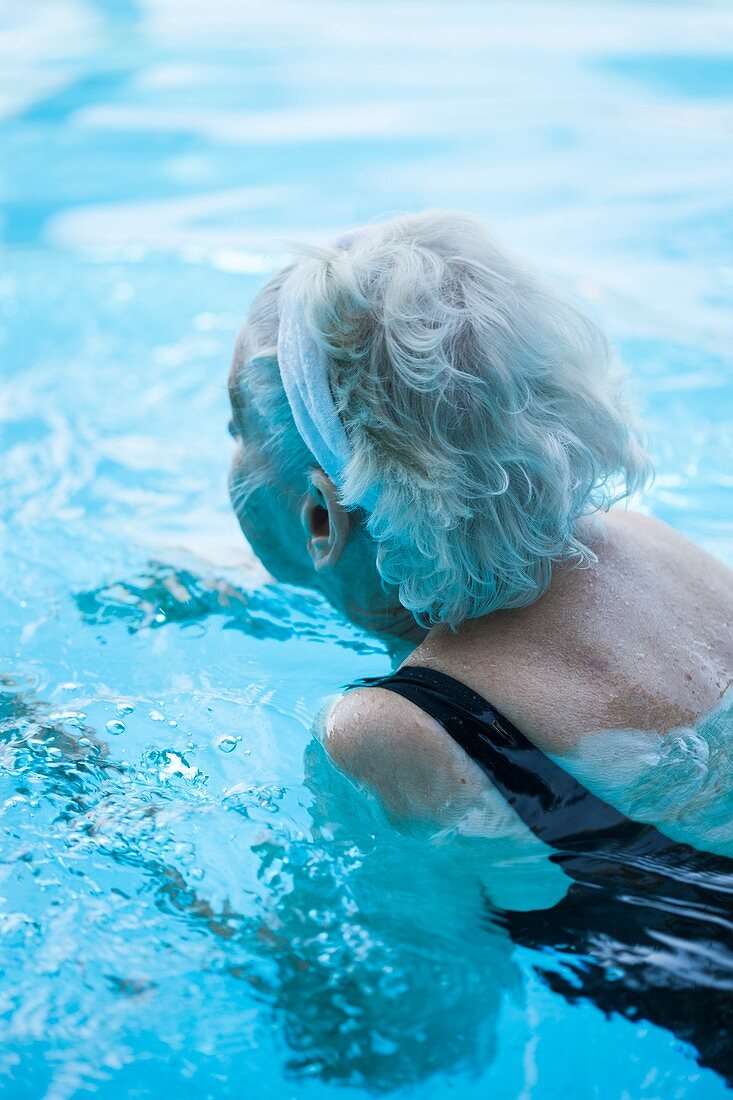 Elderly woman swimming