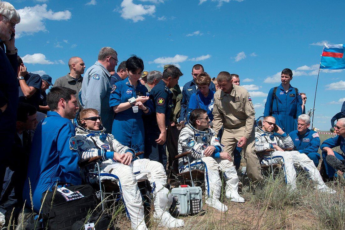 Soyuz TMA-19M astronauts after landing, June 2016