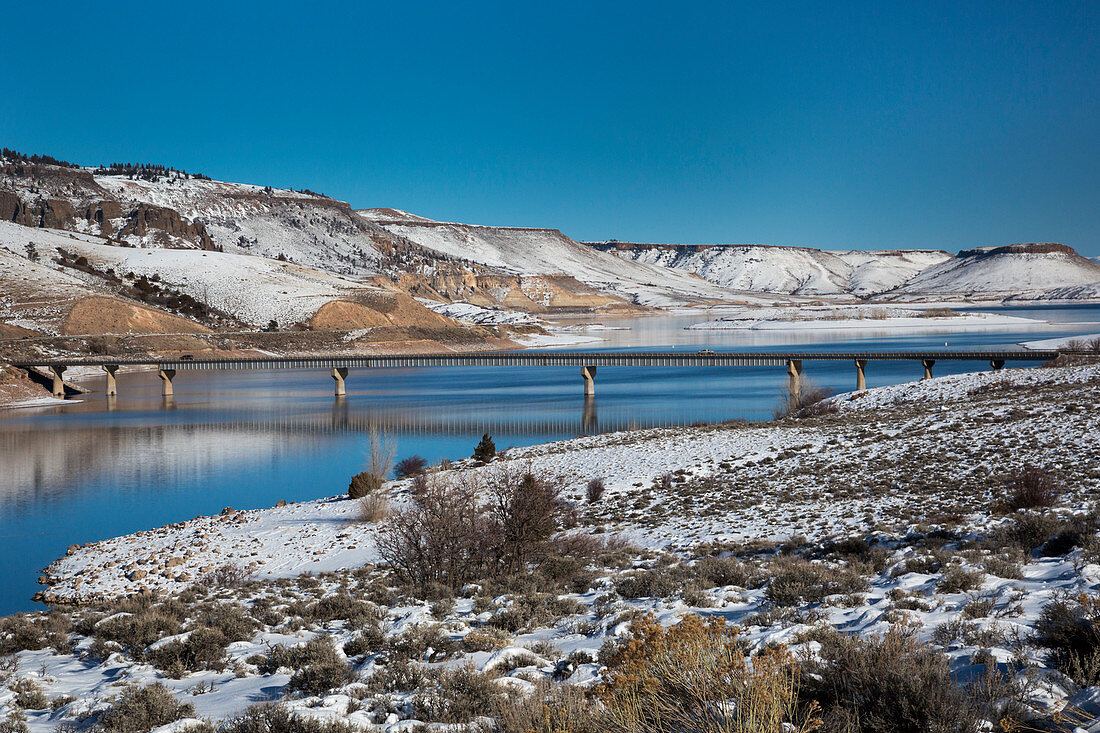 Road bridge over a reservoir in winter, USA