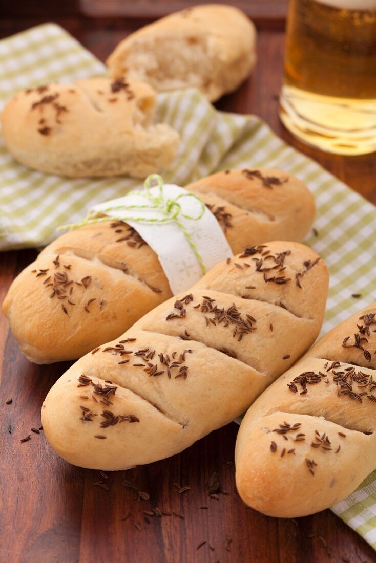 Mini caraway seed and beer baguettes