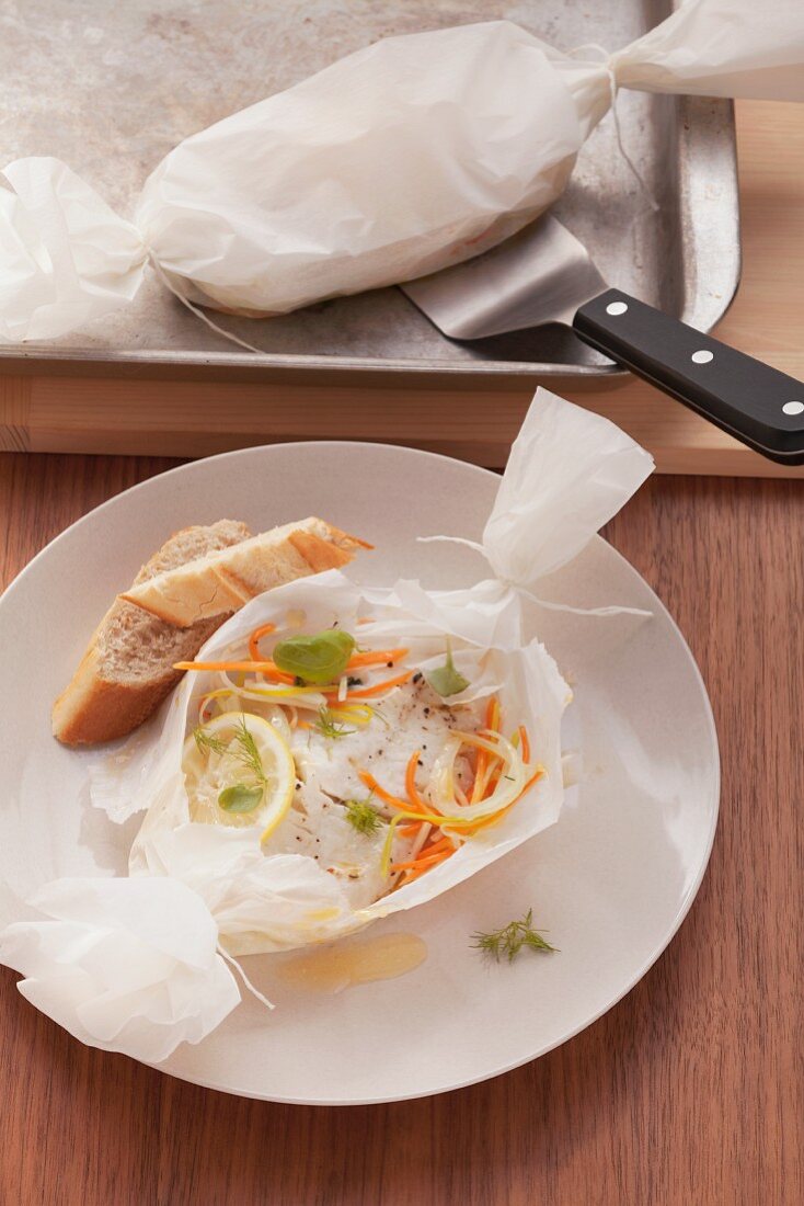 Fish fillet with vegetables cooked in parchment paper