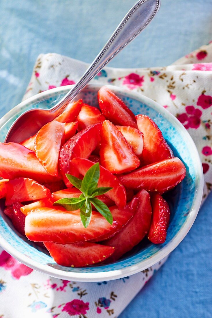 A bowl of fresh strawberries for dessert