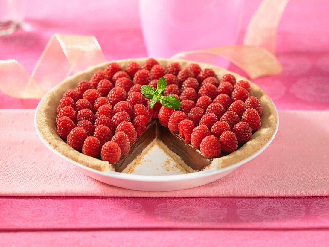 Chocolate ganache pie topped with raspberries