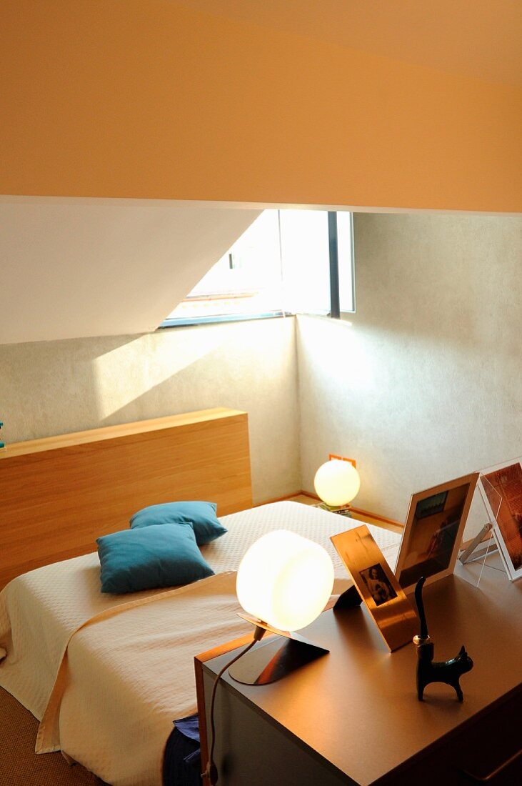 Spherical lamps in bedroom on sunken level