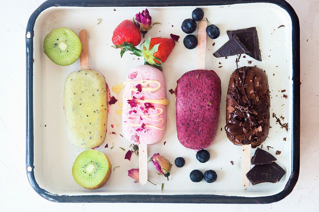 Kiwi, strawberry, blueberry and chocolate popsicles