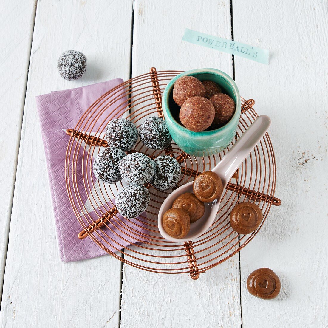 Various energy balls (chocolate and chia, cranberry and almond, and fig and walnut)