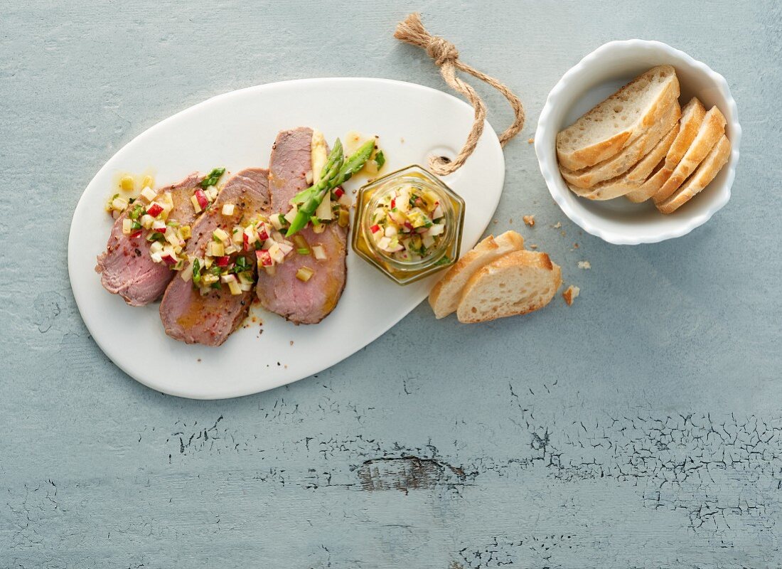 Asparagus vinaigrette with steak and fresh baguette slices