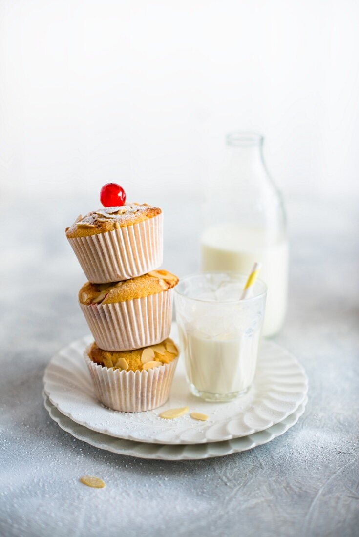 Almond muffins with cocktail cherries and milk